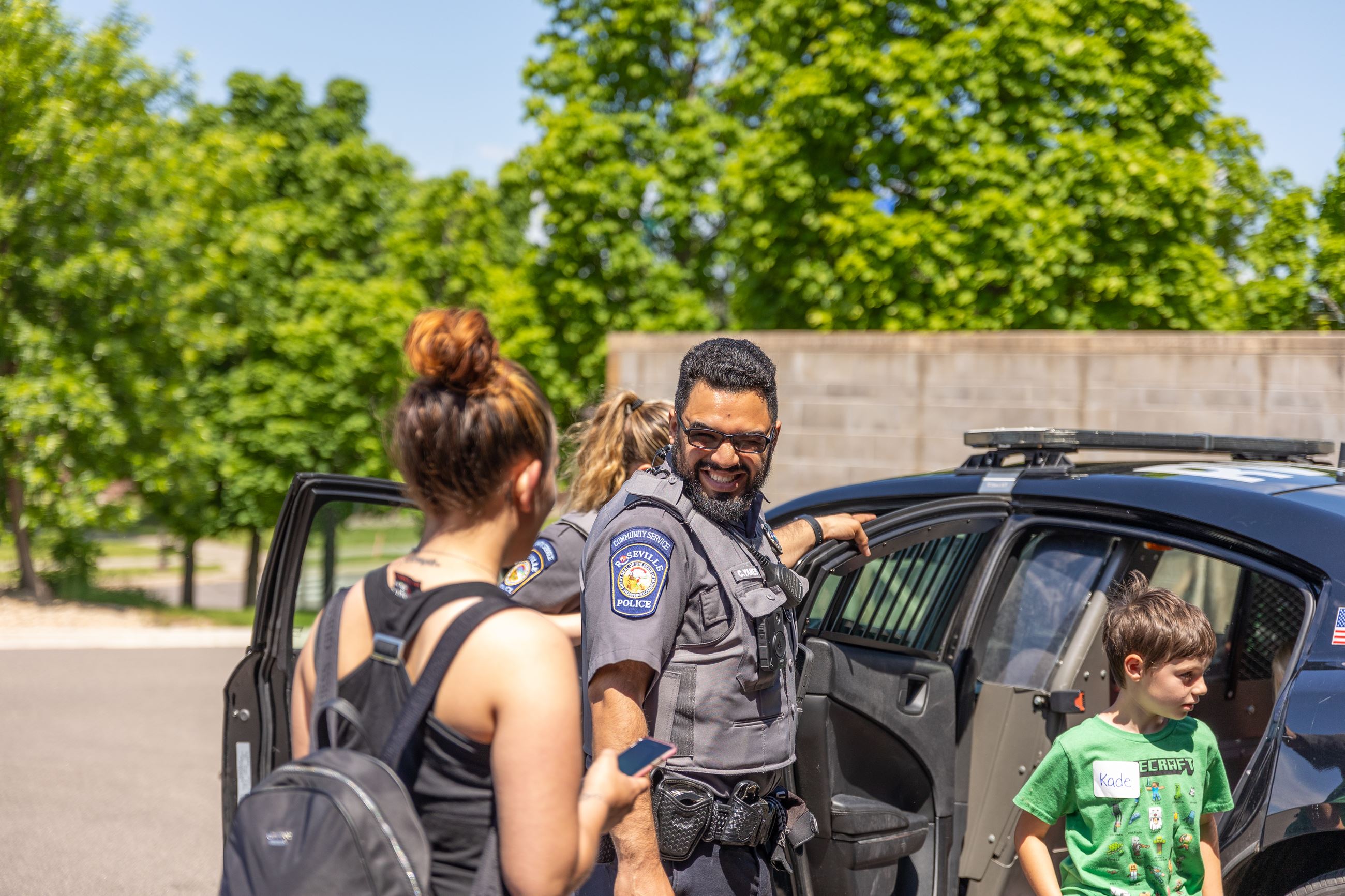 Picture of CSO letting girl out of car