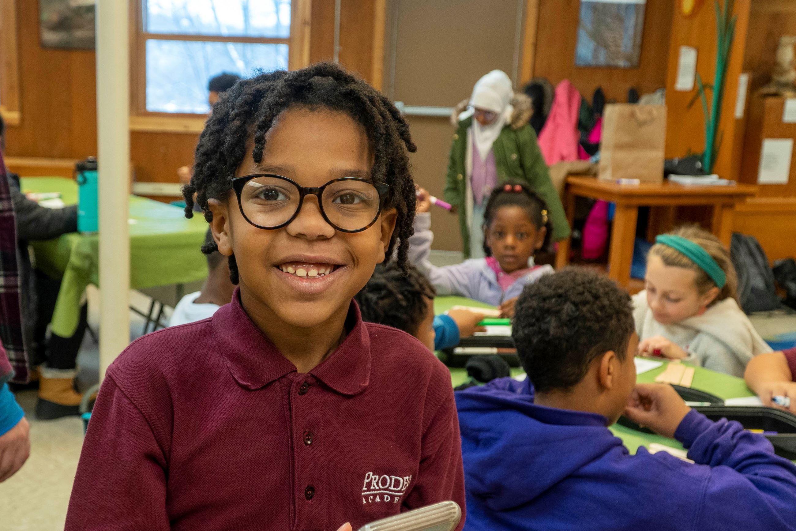 A student smiles for a picture at HANC.