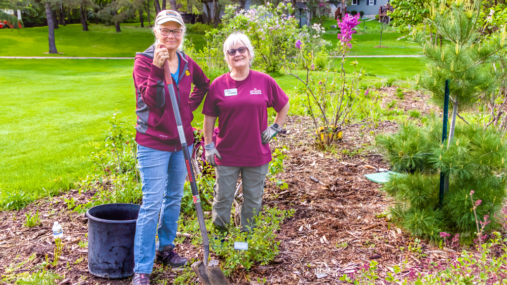 Two women volunteering to take care of the Arboretum
